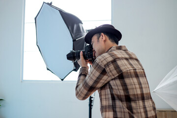 Photographer Capturing Moments with Professional Camera Equipment