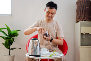 Man Enjoying Quite Morning with Coffee and Plant