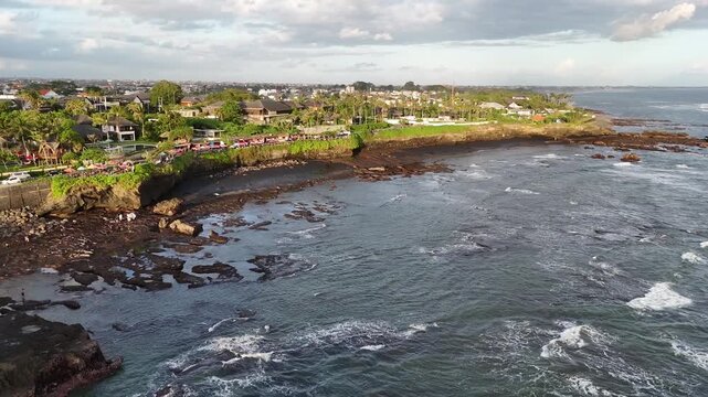 Bali beach called Prerenan north of Canggu I have recorded this drone footage at first sunlight at 5am, waiting for the sun to come up over the horizon, hitting all the notes from pink to orange, whil