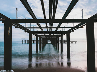 serene sunset scene with an old pier and calm sea