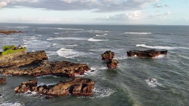 Bali beach called Prerenan north of Canggu I have recorded this drone footage at first sunlight at 5am, waiting for the sun to come up over the horizon, hitting all the notes from pink to orange, whil