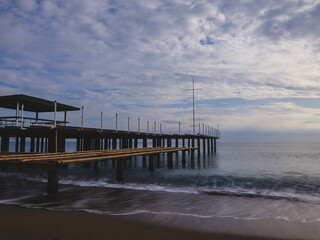 serene sunset scene with an old pier and calm sea