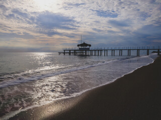 serene sunset scene with an old pier and calm sea