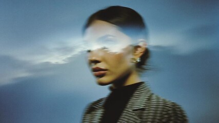 Surreal portrait woman face double exposure cloud sky concept dream mystery art blurred profile reflection motion blur dreamy mood soft focus minimal - Powered by Adobe