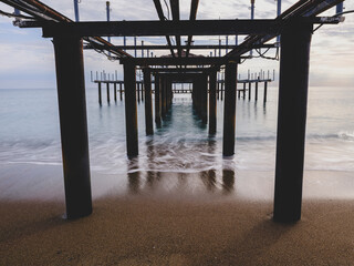 serene sunset scene with an old pier and calm sea