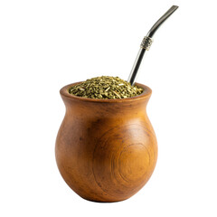 Macro photo of a traditional wooden calabash gourd with yerba mate and a silver bombilla isolated on a white background. South american beverage tradition concept