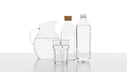 Mineral water served in glass and bottle.