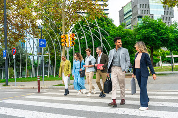 Diverse business people walking city crosswalk together