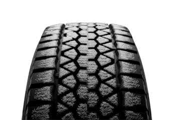 macro close-up of a rugged matte black truck winter tire, aggressive directional tread partially filled with transparent snow and ice, dramatically lit on a solid black background. concept for