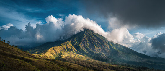 Clouds Rolling Over Volcano Mountain in Indonesia with Dramatic Tropical Landscape and Natural Atmosphere