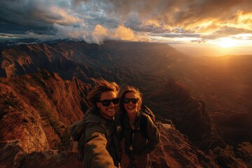 Capturing the Moment: Two Adventurers Embrace Nature's Beauty at Sunset on Majestic Mountain Peak