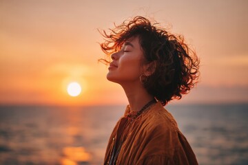 Embracing Serenity: A Woman's Journey of Self-Discovery Against a Breathtaking Sunset Over the Ocean's Horizon
