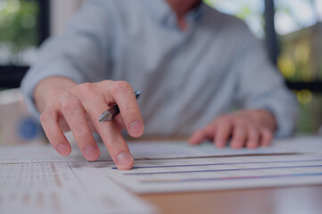 Business professional analyzing report with cost reduction and quality improvement concept, financial planning, performance management, and efficiency strategy