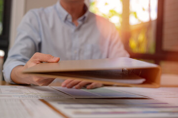 Businessman hand holding or handing over document, approval documentation agreement, document data management system, Document data system Report HR technology Concept