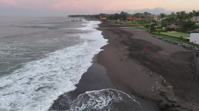 Bali beach called Prerenan north of Canggu I have recorded this drone footage at first sunlight at 5am, waiting for the sun to come up over the horizon, hitting all the notes from pink to orange, whil
