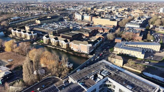 Traffic on road bridge Peterborough Cambridgeshire UK over River Nene aerial