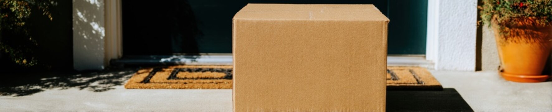 Modern Cardboard Delivery Box at Sunset Premium Advertising Content for E-commerce and Homecoming Marketing Campaigns