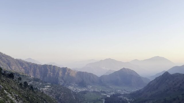 Misty mountain range at sunrise serene landscape for travel and nature conce