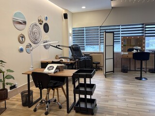 Premium coworking center for hair masters. Workplace of the hairdressers with illuminated mirrors and comfortable chairs. Concept of contemporary interior design for hairdresser. Beauty salon 
