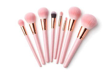Collection of pink and rose gold professional makeup brushes displayed.