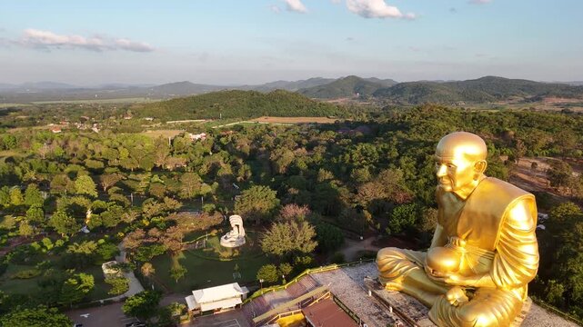 Aerial View of Large Golden Luang Pu Thuat Statue in Khao Yai