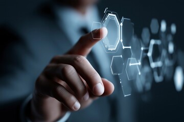 
Hand touches glowing hexagonal digital interface illustrating futuristic technology network.