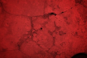 Cracked Red Wall Texture With Deep Fissures And Subtle Shadows For Background Design