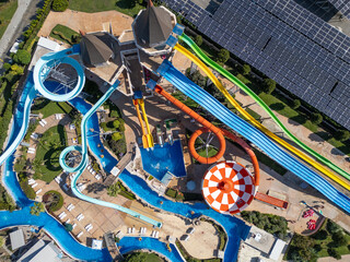 Top-down aerial view of a colorful water park in Nessebar, Bulgaria, with pools and slides. Vibrant summer resort scene showing leisure, recreation and tourism from a drone perspective