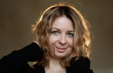 A woman with brown hair and blue eyes