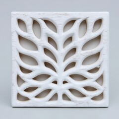 White carved wooden panel with leaf pattern