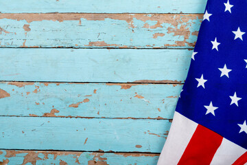 Usa flag on blue wooden wall with copy space