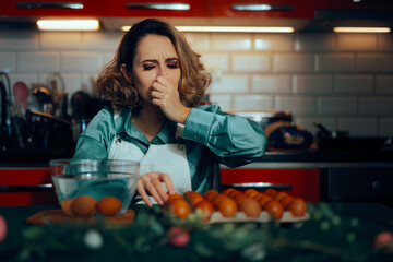 Woman Looks for a Rotten Egg and Does the Water Bowl Test. Housewife covering her because because of smelly expired produce