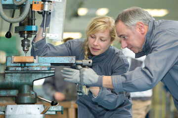 engineer training apprentice on milling machine © auremar