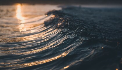 Ocean wave cresting at sunset golden hour natural abstract waterscape