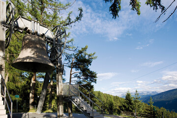 Freedom bell of Moesern Austria in scenic mountain landscape