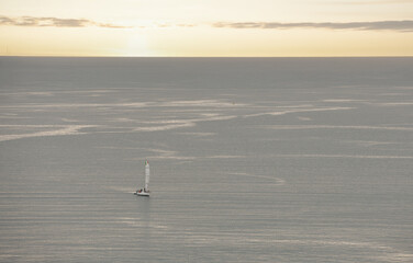 sailboat off Naples at dawn