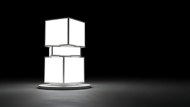 Three white cubes stacked on a circular base in a spotlight against a dark background viewed from the front