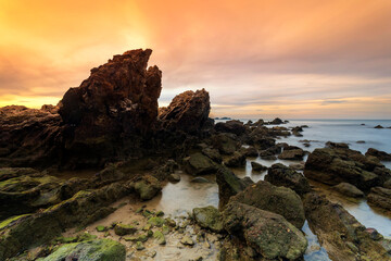 Dramatic sunrise over seascape rocky coastline on the dramatic sky in eastern of Thailand