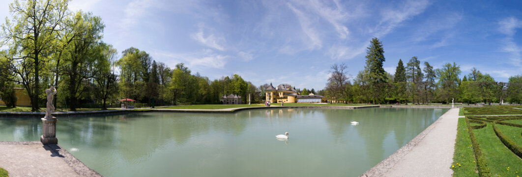 Schloss Hellbrunn palace with pond and swans in the park Salzburg Austria