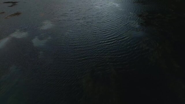 Breathtaking revealing shot of Glencoe Valley captured on a sunny winter day. Drone shot.