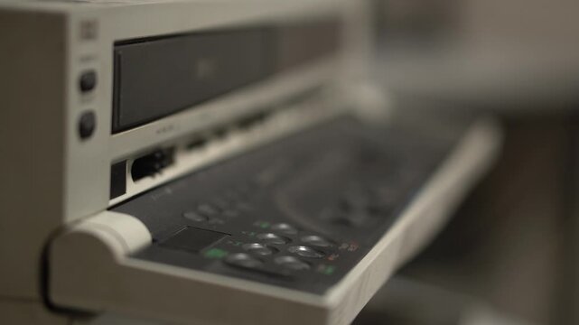 Ejecting VHS Video Cassette Tape From Professional Player Recorder, Close Up