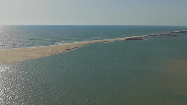Aerial view of Fuseta beach sandbar in Algarve Portugal drone footage