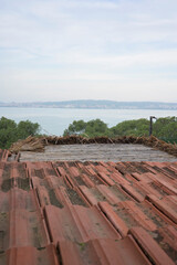 Rustic brown tile roof and sea view