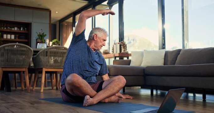 Man, stretching and pilates with laptop, home and workout routine in lounge, online and flexibility. Happy, mature person and exercise preparation on floor, balance and tips on web or tech in house