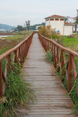 A wooden boardwalk and sunset marsh