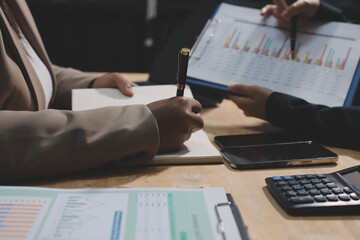 Accounting company provide finance and taxation planning for profitable cash flow, Auditor and accountant team working in office, analyze financial data and accounting record with calculator.Insight