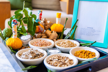 Herbal spa ingredients with fresh herbs, ginger, tropical leaves,