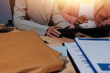 Consultation and conference of professional businesswoman and Male lawyers working and discussion having at law firm in office. Concepts of law, Judge gavel with scales of justice