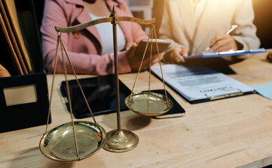 Consultation and conference of professional businesswoman and Male lawyers working and discussion having at law firm in office. Concepts of law, Judge gavel with scales of justice