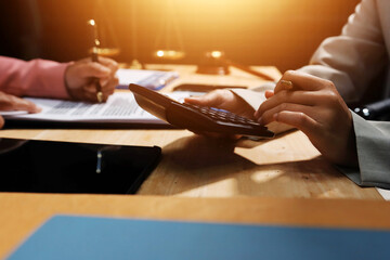 Consultation and conference of professional businesswoman and Male lawyers working and discussion having at law firm in office. Concepts of law, Judge gavel with scales of justice